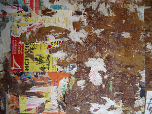 grunge wall texture with ad remains