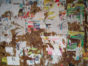 grunge wall texture with ad remains