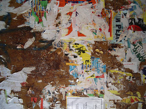 grunge wall texture with ad remains