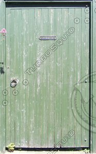 Green wooden door to garden