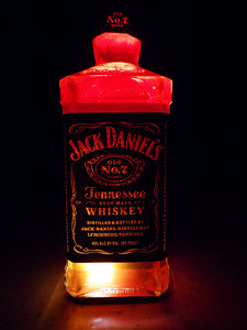 lighted whiskey liquor bottle
